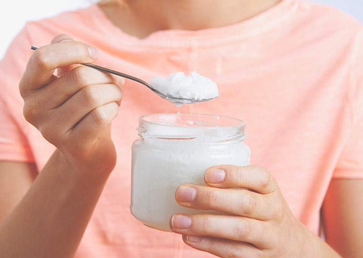 woman-holding-coconut-oil-1.jpg