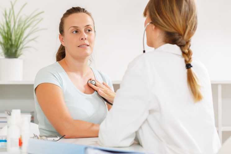 Doctor-listening-to-a-womans-heart-with-a-stethoscope-e1460674034637.jpg