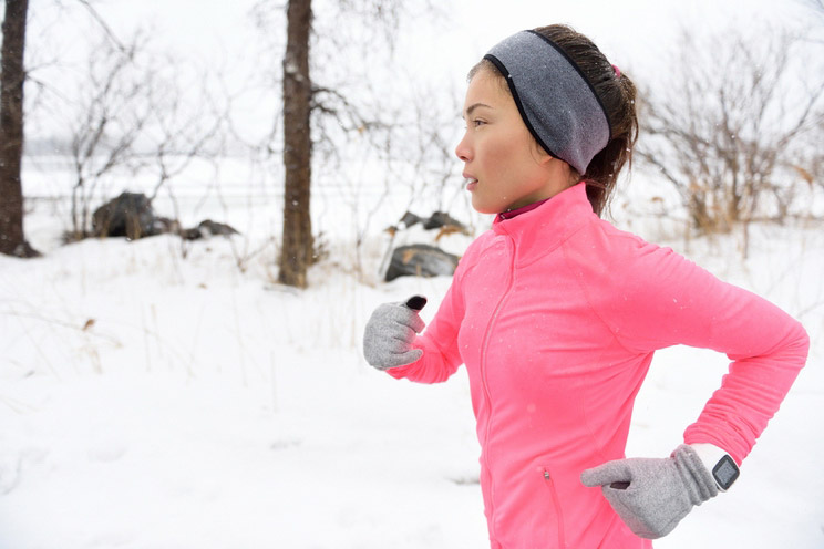 Female-runner-trail-running-in-cold-snowing-weather.jpg