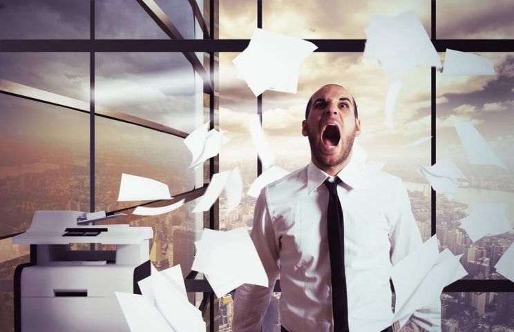 Businessman-stressed-and-overworked-yelling-in-office-e1461303188250.jpg