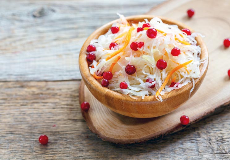 Bowl-with-sauerkraut-and-cranberry-on-an-old-wooden-table.jpg